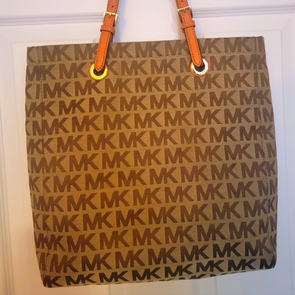 Michael Kors Handbags - Pre-loved Micheal Kors Signature Tote with Orange leather straps.